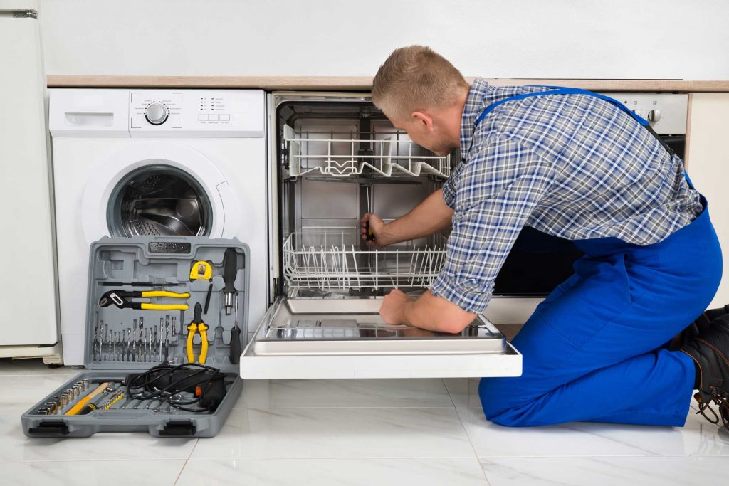 technician fixing a dishwasher repair gastonia
