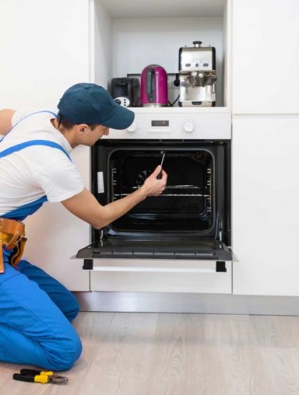 man repairing oven - About Gastonia Appliance Repair Pros - Oven Repair Gastonia
